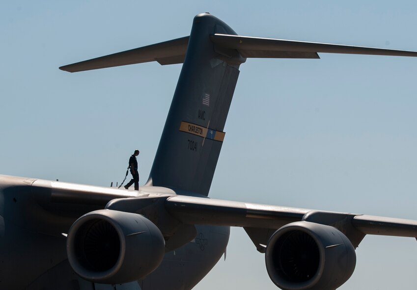 An Airman inspects the wing of a C-17 Globemaster III at Barksdale Air Force Base, La., Oct. 6, 2016. More than 100 aircraft from Shaw Air Force Base, S.C., Joint Base Charleston, S.C., and Seymour Johnson Air Force Base, N.C., were relocated to avoid potential damage from Hurricane Matthew along the East Coast. (U.S. Air Force photo/Airman Alexis C. Schultz)