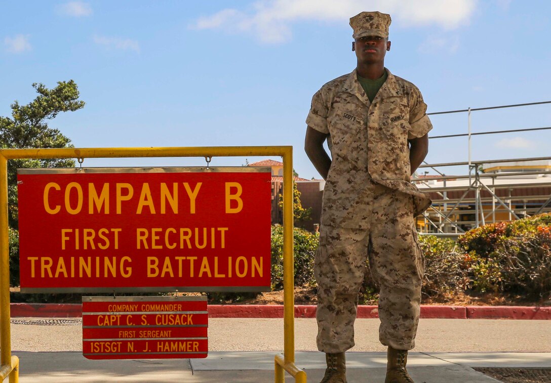 Private First Class Le’Darius S. Scott, Bravo Company, 1st Recruit Training Battalion, stands with his senior drill instructor outside his squad bay at Marine Corps Recruit Depot San Diego, Oct. 11. Following recruit training, Scott will report to the School of Infantry at Marine Corps Base Camp Pendleton, Calif., and then to his military occupational specialty school to become an administration specialist. Annually, more than 17,000 males recruited from the Western Recruiting Region are trained at MCRD San Diego.