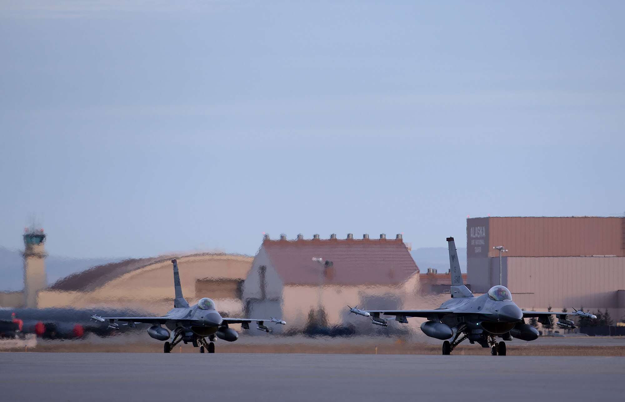 A pair of U.S. Air Force F-16 Fighting Falcons assigned to the 36th Fighter Squadron out of Osan Air Base, Republic of Korea, taxi down the Eielson Air Force Base, Alaska, flight line Oct. 10, 2016, during RED FLAG-Alaska (RF-A) 17-1. Conducting RED FLAG training in Alaska signifies a continued commitment to the Pacific, providing U.S. and international units the opportunity to sharpen their combat skills and strengthen interoperability in a realistic threat environment inside the Joint Pacific Alaska Range Complex, the largest instrumented air, ground and electronic combat training range in the world. (U.S. Air Force photo by Master Sgt. Karen J. Tomasik)