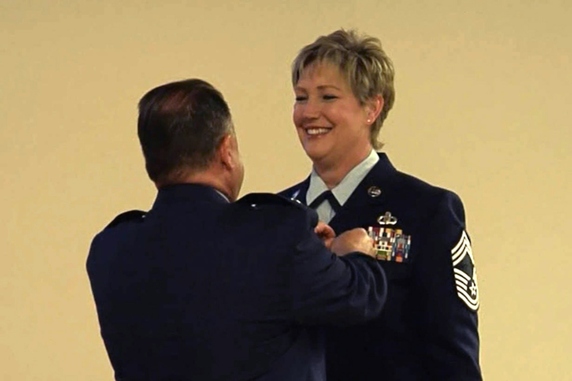 Lt. Col. David Lalonde (left), commander of the 123rd Operations Support Squadron, pins the Meritorious Service Medal onto Chief Master Sgt. Joan Hazle (right), the outgoing superintendent of the Aircrew Flight Equipment Office, during Hazle’s retirement ceremony at the Kentucky Air National Guard Base in Louisville, Ky., April 17, 2016. Hazle is retiring after more than 30 years of service to the active-duty Air Force and Air National Guard. (U.S. Air National Guard photo)