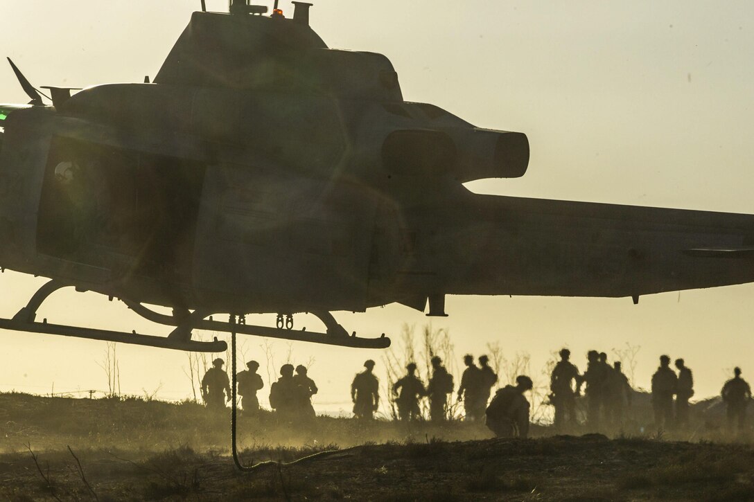 A UH-1Y Huey helicopter prepares to land after Marines finish a fast-rope drill at Marine Corps Base Camp Pendleton, Calif., Oct. 6, 2016. The training enabled air and ground units to train together. Marine Corps photo by Sgt. Lillian Stephens