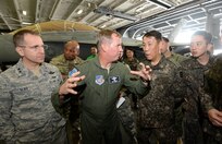 (Center) Lieutenant General Thomas Bergeson, U.S. Forces Korea deputy commander, and Gen. Leem, Ho Young, Combined Forces Command deputy commander, observe an operational briefing aboard the USS Ronald Reagan (CVN
76) during the Invincible Spirit exercise Oct. 13. 

The USS Ronald Reagan is currently underway in the waters around the Korean Peninsula. Invincible Spirit is a bilateral exercise designed to strengthen maritime interoperability through comprehensive training, anti-submarine and anti-surface warfare drills, communication drills, air defense exercises, and counter-mine planning. 

"The strength of the bond between the United States and the Republic of Korea is ironclad and that commitment is further reinforced by exercises like this," said Lt. Gen. Bergeson. "The teamwork and learning gained is invaluable and bolsters our ability to fight tonight."
