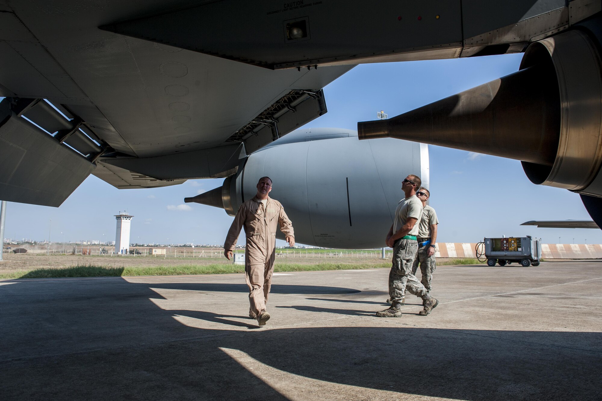 U.S. Air Force Capt. Jason, 22nd Expeditionary Air Refueling Squadron (EARS) KC-135 Stratotanker aircraft commander, walks around the aircraft to perform preflight inspections with Tech. Sgt. Jason and Staff Sgt. Jake, 22d EARS crew chiefs Sept. 19, 2016, at Incirlik Air Base, Turkey. Preflight inspections are required to be performed before every aircraft takeoff to better ensure safety. (U.S. Air Force photo by Staff Sgt. Jack Sanders)