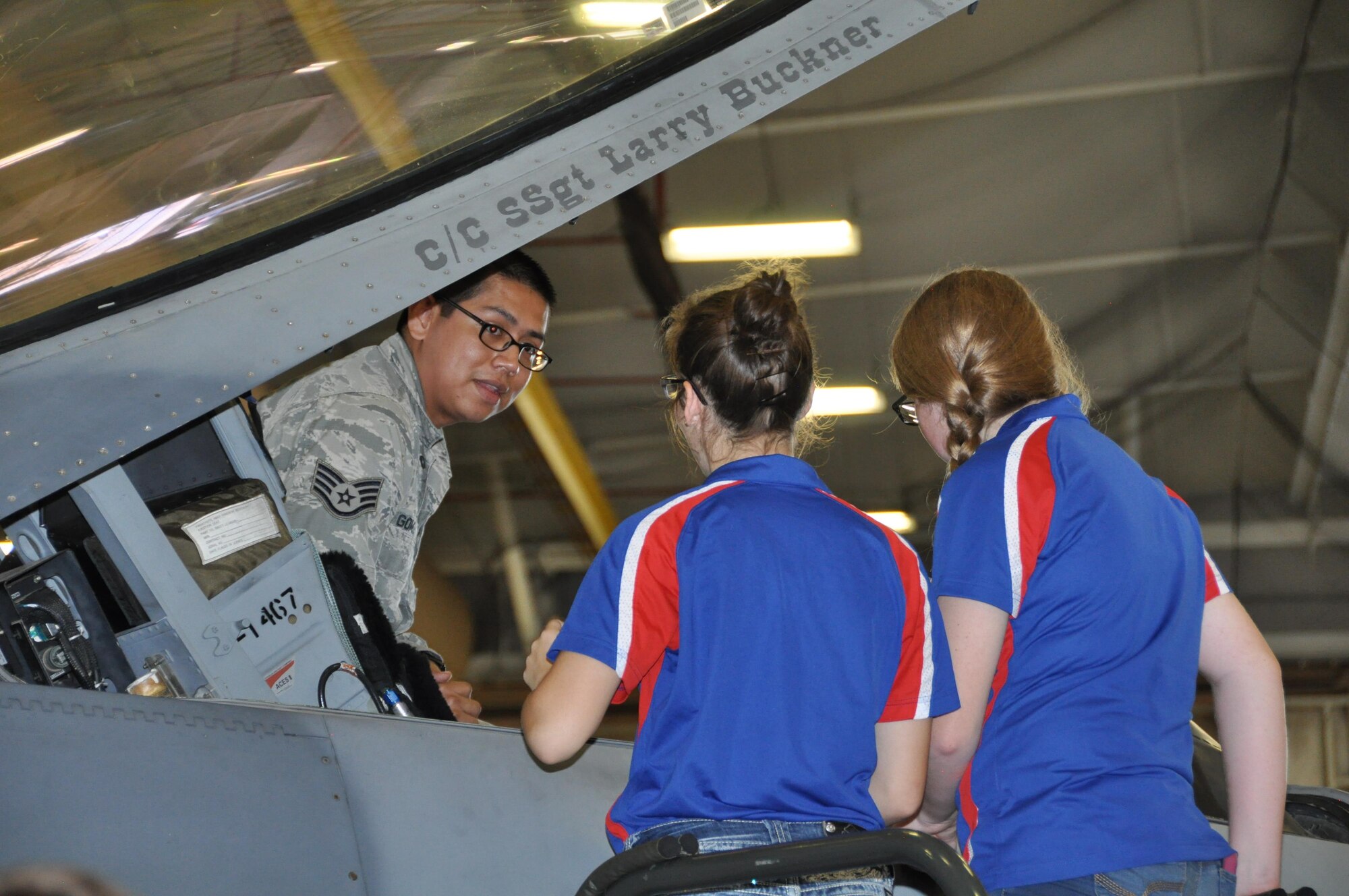 Staff Sgt. Arturo Gomez, Jr., 301st Maintenance Squadron, shows Junior Reserve Officer Training cadets the F-16 Fighting Falcon cockpit during a tour around Naval Air Station Fort Worth Joint Reserve Base, Texas, Oct. 5, 2016. Forty-two cadets from Burleson high school explored the 301st Civil Engineer Squadron Explosive Ordnance Disposal demonstration, the Army Bravo Company 90th Aviation Support Battalion’s Black Hawk helicopter, the base control tower and its radar site. (U.S. Air Force photo by Julie Briden-Garcia)