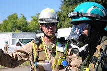 Chief Warrant Officer 2 Scott D. Myhra, platoon commander for identification and detection platoon, IDP, Chemical Biological Incident Response Force, CBIRF, and chemical biological radiological nuclear, CBRN, officer for Initial Response Force, IRF, B, left, talks to Cpl. Alex Sousa, team leader with IDP, CBIRF, right, before heading into the contaminated zone or “hot zone” to search and identify contaminants around a steam plant as part of a final training exercise with the Fire Department of New York, FDNY, on Randall’s Island, N.Y., Sept. 15, 2016. CBIRF’s Marines and sailors participated in a training event that included three days of lane training with FDNY instructors teaching classes in vehicle extrication, breaching, rope rescue and medical as part of urban rescue operations, and a final training operation in which CBIRF responded to a notional steam plant explosion. (Official U.S. Marine Corps photo by Lance Cpl. Maverick S. Mejia/RELEASED)
