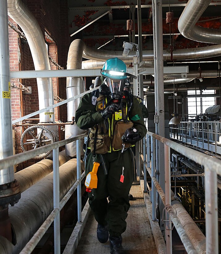 Marines with Identification and Detection Platoon, IDP, part of the primary assessment team, Chemical Biological Incident Response Force, CBIRF, locate and assess casualties found at a steam plant during a training exercise with the Fire Department of New York, FDNY, on Randall’s Island, N.Y., Sept. 15, 2016. CBIRF’s Marines and sailors participated in a training event that included three days of lane training with FDNY instructors teaching classes in vehicle extrication, breaching, rope rescue and medical as part of urban rescue operations, and a final training operation in which CBIRF responded to a notional steam plant explosion. (Official U.S. Marine Corps photo by Lance Cpl. Maverick S. Mejia/RELEASED)
