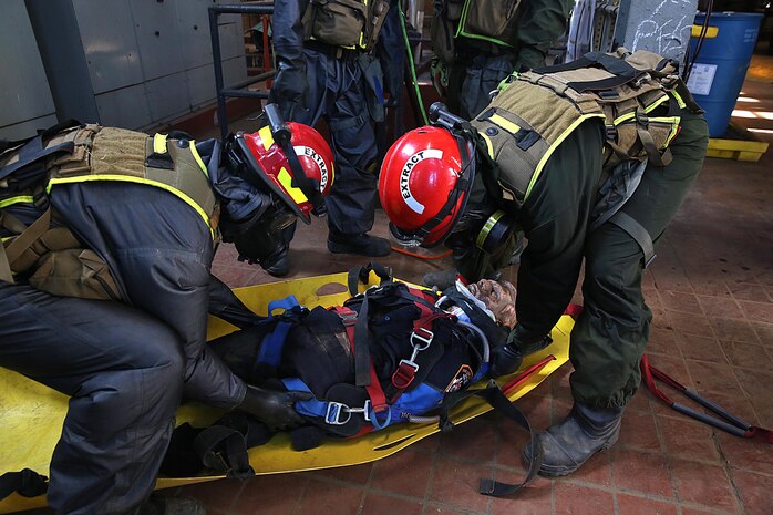 Marines with Search and Extraction Platoon, Chemical Biological Incident Response Force, CBIRF, extracted numerous casualties as part of a final training exercise with the Fire Department of New York, FDNY, on Randall’s Island, N.Y., Sept. 15, 2016. CBIRF’s Marines and sailors participated in a training event that included three days of lane training with FDNY instructors teaching classes in vehicle extrication, breaching, rope rescue and medical as part of urban rescue operations, and a final training operation in which CBIRF responded to a notional steam plant explosion. (Official U.S. Marine Corps photo by Lance Cpl. Maverick S. Mejia/RELEASED)
