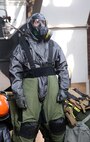 Staff Sgt. Matthew Burke, an explosive ordnance disposal, EOD, technician with Chemical Biological Incident Response Force, CBIRF, puts on an EOD bomb suit while already in a level “c” suit during a final training exercise with the Fire Department of New York, FDNY, on Randall’s Island, N.Y., Sept. 15, 2016. CBIRF’s Marines and sailors participated in a training event that included three days of lane training with FDNY instructors teaching classes in vehicle extrication, breaching, rope rescue and medical as part of urban rescue operations, and a final training operation in which CBIRF responded to a notional steam plant explosion. (Official U.S. Marine Corps photo by Lance Cpl. Maverick S. Mejia/RELEASED)


