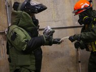 Marines with Explosive Ordnance Disposal, EOD, platoon, Chemical Biological Incident Response Force, CBIRF, participate in a final training exercise with Fire Department of New York, FDNY, responding to and deactivating a notional explosive threat found at a steam plant on Randall’s Island, N.Y., Sept. 15, 2016. CBIRF’s Marines and sailors participated in a training event that included three days of lane training with FDNY instructors teaching classes in vehicle extrication, breaching, rope rescue and medical as part of urban rescue operations, and a final training operation in which CBIRF responded to a notional steam plant explosion. (Official U.S. Marine Corps photo by Lance Cpl. Maverick S. Mejia/RELEASED)
