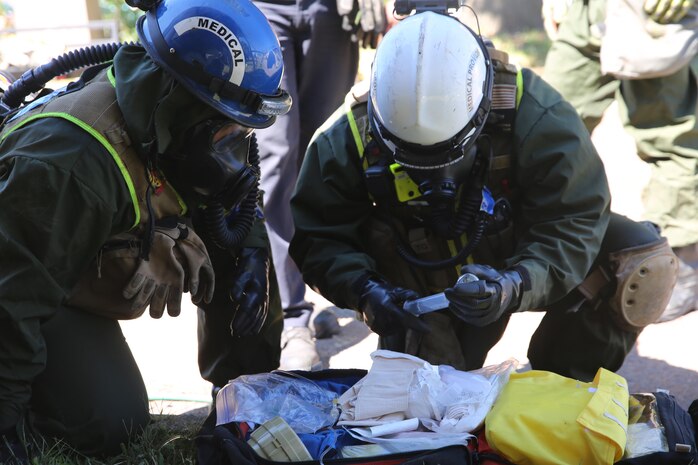 Corpsmen with Chemical Biological Incident Response Force, CBIRF, assess and attend to simulated casualties of a notional steam plant explosion as part of a final training exercise with Fire Department of New York, FDNY, on Randall’s Island, N.Y., Sept. 15, 2016. CBIRF’s Marines and sailors participated in a training event that included three days of lane training with FDNY instructors teaching classes in vehicle extrication, breaching, rope rescue and medical as part of urban rescue operations, and a final training operation in which CBIRF responded to a notional steam plant explosion. (Official U.S. Marine Corps photo by Lance Cpl. Maverick S. Mejia/RELEASED)
