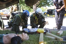 Corpsmen with Chemical Biological Incident Response Force, CBIRF, assess and attend to simulated casualties of a notional steam plant explosion as part of a final training exercise with Fire Department of New York, FDNY, on Randall’s Island, N.Y., Sept. 15, 2016. CBIRF’s Marines and sailors participated in a training event that included three days of lane training with FDNY instructors teaching classes in vehicle extrication, breaching, rope rescue and medical as part of urban rescue operations, and a final training operation in which CBIRF responded to a notional steam plant explosion. (Official U.S. Marine Corps photo by Lance Cpl. Maverick S. Mejia/RELEASED)
