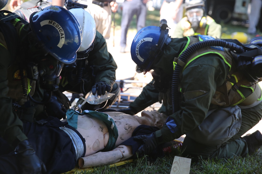 Corpsmen with Chemical Biological Incident Response Force, CBIRF, assess and attend to simulated casualties of a notional steam plant explosion as part of a final training exercise with Fire Department of New York, FDNY, on Randall’s Island, N.Y., Sept. 15, 2016. CBIRF’s Marines and sailors participated in a training event that included three days of lane training with FDNY instructors teaching classes in vehicle extrication, breaching, rope rescue and medical as part of urban rescue operations, and a final training operation in which CBIRF responded to a notional steam plant explosion. (Official U.S. Marine Corps photo by Lance Cpl. Maverick S. Mejia/RELEASED)

