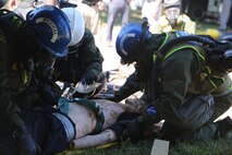 Corpsmen with Chemical Biological Incident Response Force, CBIRF, assess and attend to simulated casualties of a notional steam plant explosion as part of a final training exercise with Fire Department of New York, FDNY, on Randall’s Island, N.Y., Sept. 15, 2016. CBIRF’s Marines and sailors participated in a training event that included three days of lane training with FDNY instructors teaching classes in vehicle extrication, breaching, rope rescue and medical as part of urban rescue operations, and a final training operation in which CBIRF responded to a notional steam plant explosion. (Official U.S. Marine Corps photo by Lance Cpl. Maverick S. Mejia/RELEASED)
