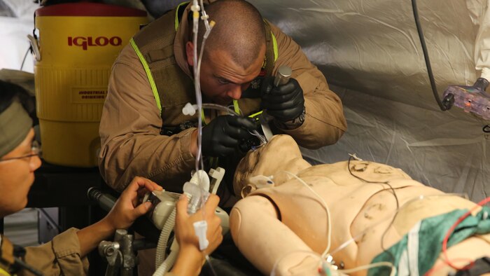 Corpsmen with Chemical Biological Incident Response Force, CBIRF, assess and attend to simulated casualties of a notional steam plant explosion as part of a final training exercise with Fire Department of New York, FDNY, on Randall’s Island, N.Y., Sept. 15, 2016. CBIRF’s Marines and sailors participated in a training event that included three days of lane training with FDNY instructors teaching classes in vehicle extrication, breaching, rope rescue and medical as part of urban rescue operations, and a final training operation in which CBIRF responded to a notional steam plant explosion. (Official U.S. Marine Corps photo by Lance Cpl. Maverick S. Mejia/RELEASED)

