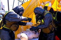 Marines with Decontamination Platoon, Chemical Biological Incident Response Force, CBIRF, participate in a final training exercise with Fire Department of New York, FDNY, decontaminating casualties that were extracted out of a steam plant at Randall’s Island, N.Y., on Sept. 15, 2016. CBIRF’s Marines and sailors participated in a training event that included three days of lane training with FDNY instructors teaching classes in vehicle extrication, breaching, rope rescue and medial as part of urban rescue operations, and a final training operation in which CBIRF responded to a notional steam plant explosion. (Official U.S. Marine Corps photo by Lance Cpl. Maverick S. Mejia/RELEASED)
