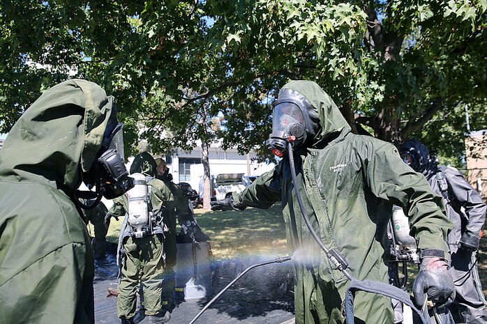 Marines with Decontamination Platoon, Chemical Biological Incident Response Force, CBIRF, participate in a final training exercise with Fire Department of New York, FDNY, creating a force protection decontamination lane for Marines and sailors coming out of the “hot zone” at Randall’s Island, N.Y., Sept. 15, 2016. CBIRF’s Marines and sailors participated in a training event that included three days of lane training with FDNY instructors teaching classes in vehicle extrication, breaching, rope rescue and medical as part of urban rescue operations, and a final training operation in which CBIRF responded to a notional steam plant explosion. (Official U.S. Marine Corps photo by Lance Cpl. Maverick S. Mejia/RELEASED)
