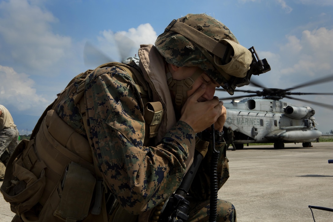 A U.S. Marine with the 24th Marine Expeditionary Unit (24th MEU), does a radio check during a disaster relief mission at Port-au-Prince, Haiti, Oct. 10, 2016. The 24th MEU is part of a larger U.S. response to the government of Haiti request for humanitarian assistance. The U.S. effort is coordinated by the Department of State and the U.S. Agency for International Development. (U.S. Marine Corps photo by Lance Cpl. Melanye E. Martinez)