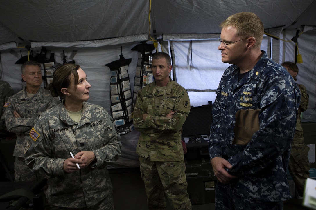 U.S. military medical personnel discuss medical capabilities at Port-au-Prince, Haiti, Oct. 10, 2016. The United States military is currently providing humanitarian relief assistance in Haiti because of the aftermath of Hurricane Matthew. (U.S. Marine Corps photo by Lance Cpl. Melanye E. Martinez)