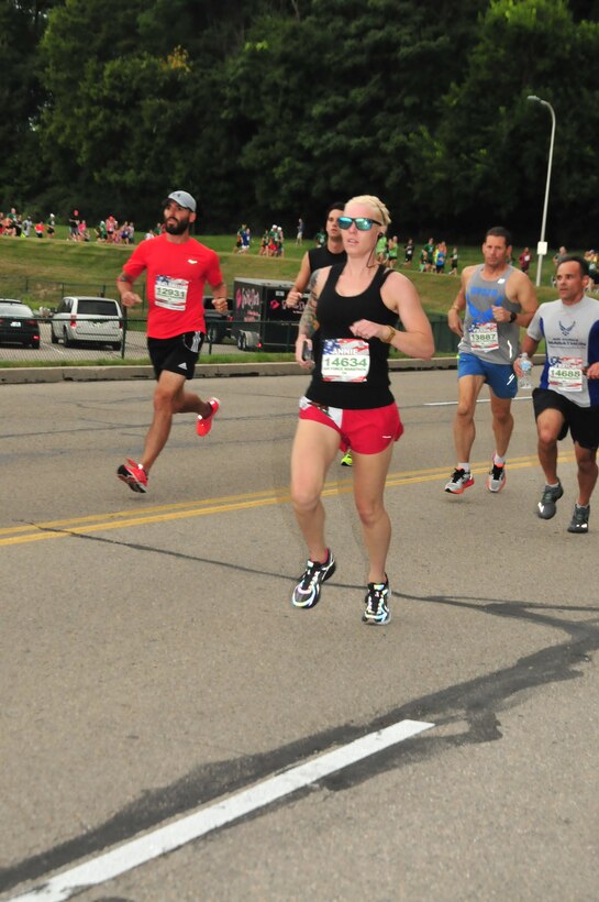 Staff Sgt. Anne Pennington, 701st Munitions Support Squadron NCO in charge of support at Kleine Brogel Air Base, Belgium, runs during the 20th U.S. Air Force Marathon at Wright-Patterson Air Force Base, Ohio, with a time of 21:06. Pennington broke the Air Force record for the women's 5K category during this run. (U.S. Air Force courtesy photo)