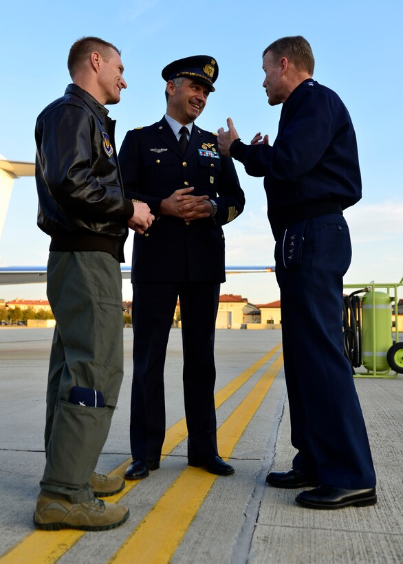 Brig. Gen. Lance Landrum, 31st Fighter Wing Commander, and Col. Stefano Cianfrocca, Aviano Italian base commander, speak with Gen. Tod D. Wolters, U.S. Air Forces in Europe - Air Forces Africa commander, after his arrival at Aviano Air Base, Italy on Oct. 13, 2016. Wolters’ main focus was to meet Airmen and speak with them about his mission priorities. (U.S. Air Force photo by Airman 1st Class Cary Smith/Released)