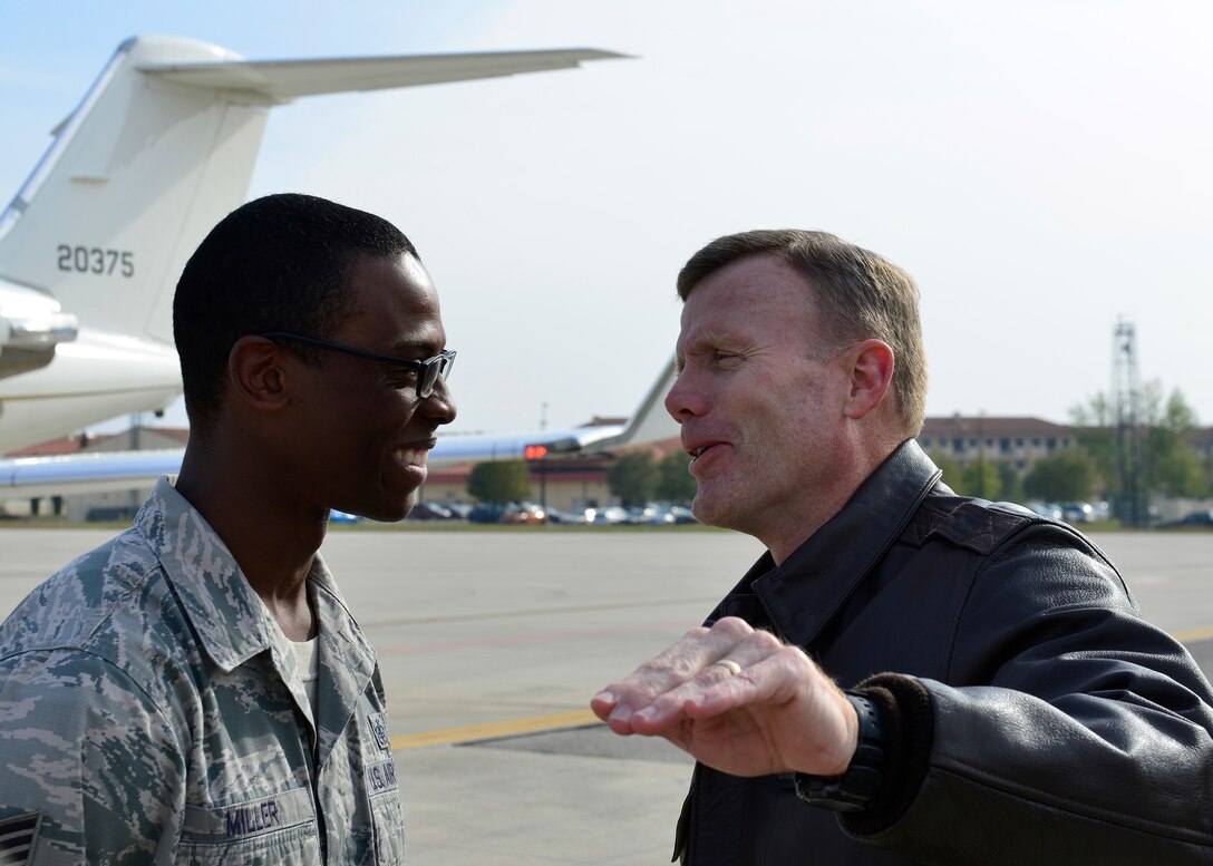 Gen. Tod D. Wolters, U.S. Air Forces in Europe - Air Forces Africa commander, speaks with Tech. Sgt. Theodore Miller, 31st Fighter Wing NCO in charge of protocol, during his visit to Aviano Air Base, Italy on Oct. 13, 2016. Wolters toured the base, met with Airmen and held an all call where he discussed his priorities for USAFE-AFAFRICA. (U.S. Air Force photo by Airman 1st Class Cary Smith/Released)