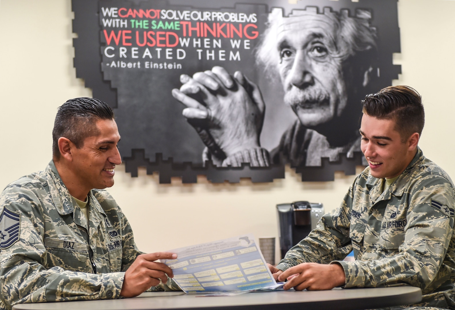 Senior Master Sgt. Jose Diaz, the 59th Medical Wing career assistance advisor, briefs Airman 1st Class Felipe Morais, a 59th MDW personnel specialist, on retraining opportunities Sept. 22, 2016 at the Wilford Hall Ambulatory Surgical Center on Joint Base San Antonio-Lackland, Texas. Diaz advises Airmen on a wide array of subjects such as military benefits and entitlements, retraining, special duty assignments and professional development. (U.S. Air Force photo/Staff Sgt. Michael Ellis)
