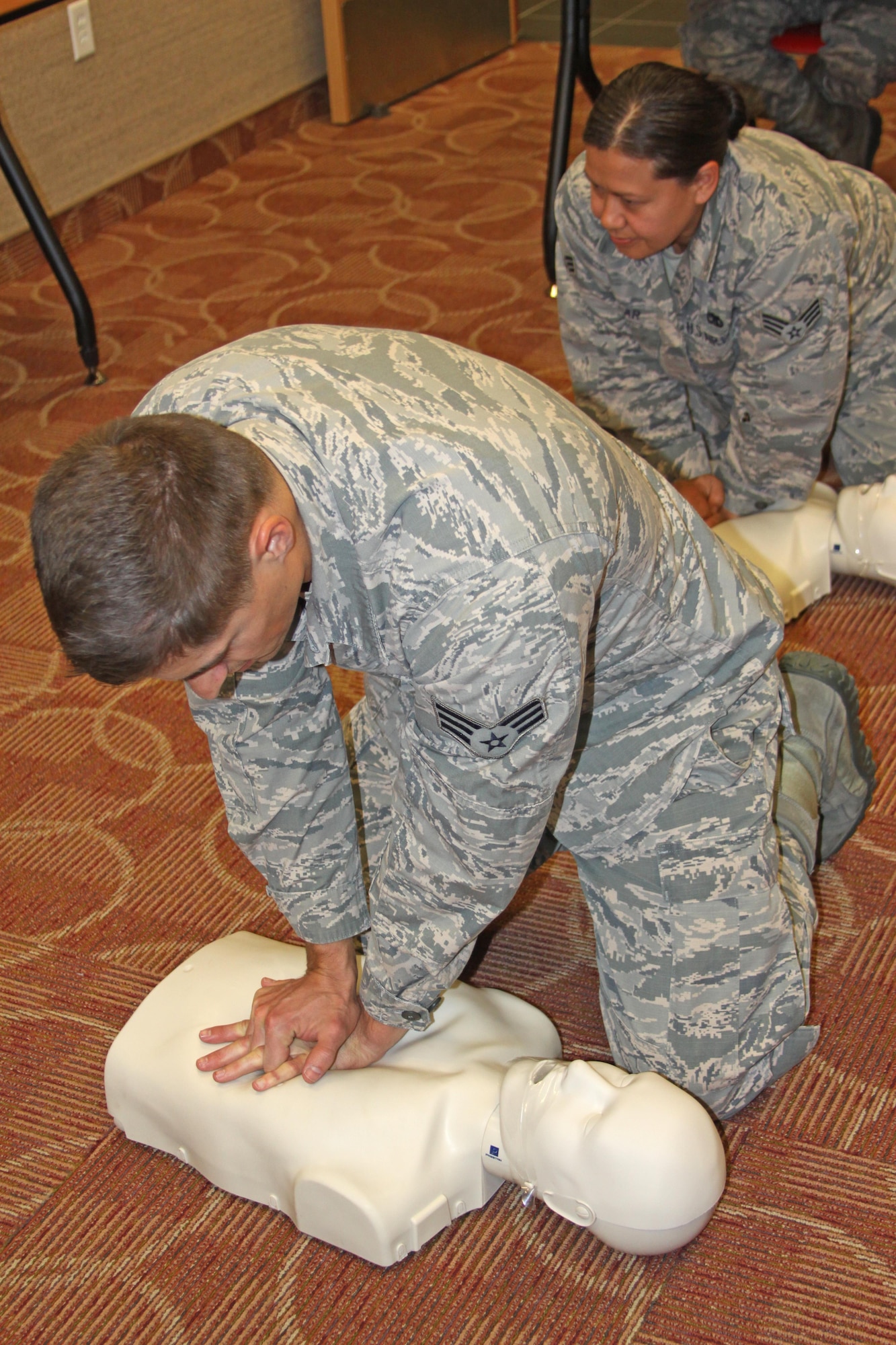 Senior Airman Anton Rozodovskiy and Senior Airman Sharon Zellar practice CPR (Cardiopulmonary resuscitation) training at the 477th Fighter Group Aircraft Maintenance Squadron on Oct. 02, 2016, during a unit training assembly at Joint Base Elmendorf-Richardson, Alaska. (Photos by Staff Sgt. Mike Campbell) (Released)