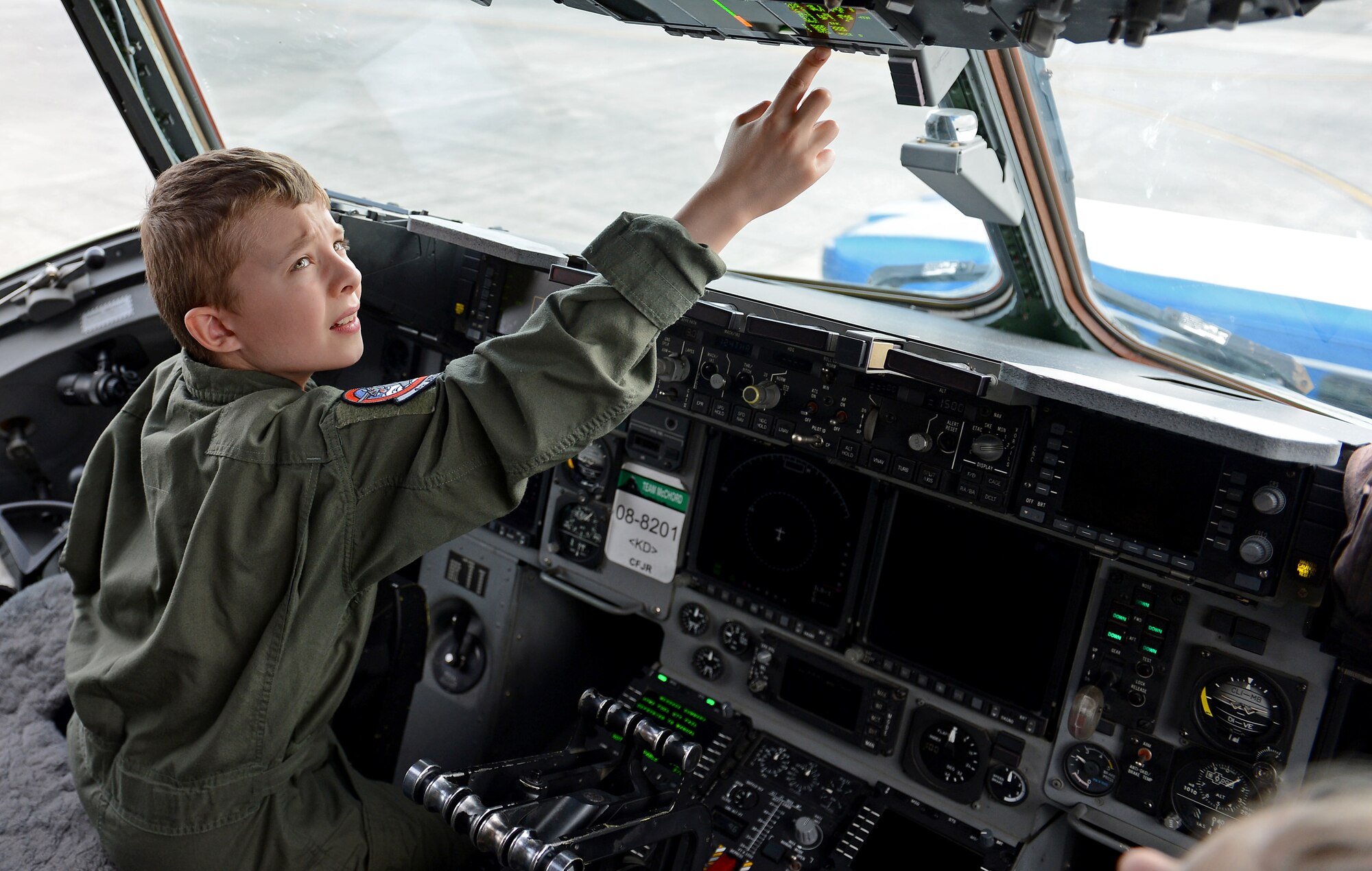 Ben Lambertson views the cockpit of a C-17 Globemaster III during his Pilot for a Day visit Oct. 7, 2016 at Joint Base Lewis-McChord, Wash. Ben and his family had the opportunity to see an actual C-17 Globemaster III and take photos in the cockpit before heading back to the squadron for cake and ice cream. (U.S. Air Force photo/Senior Airman Divine Cox)
