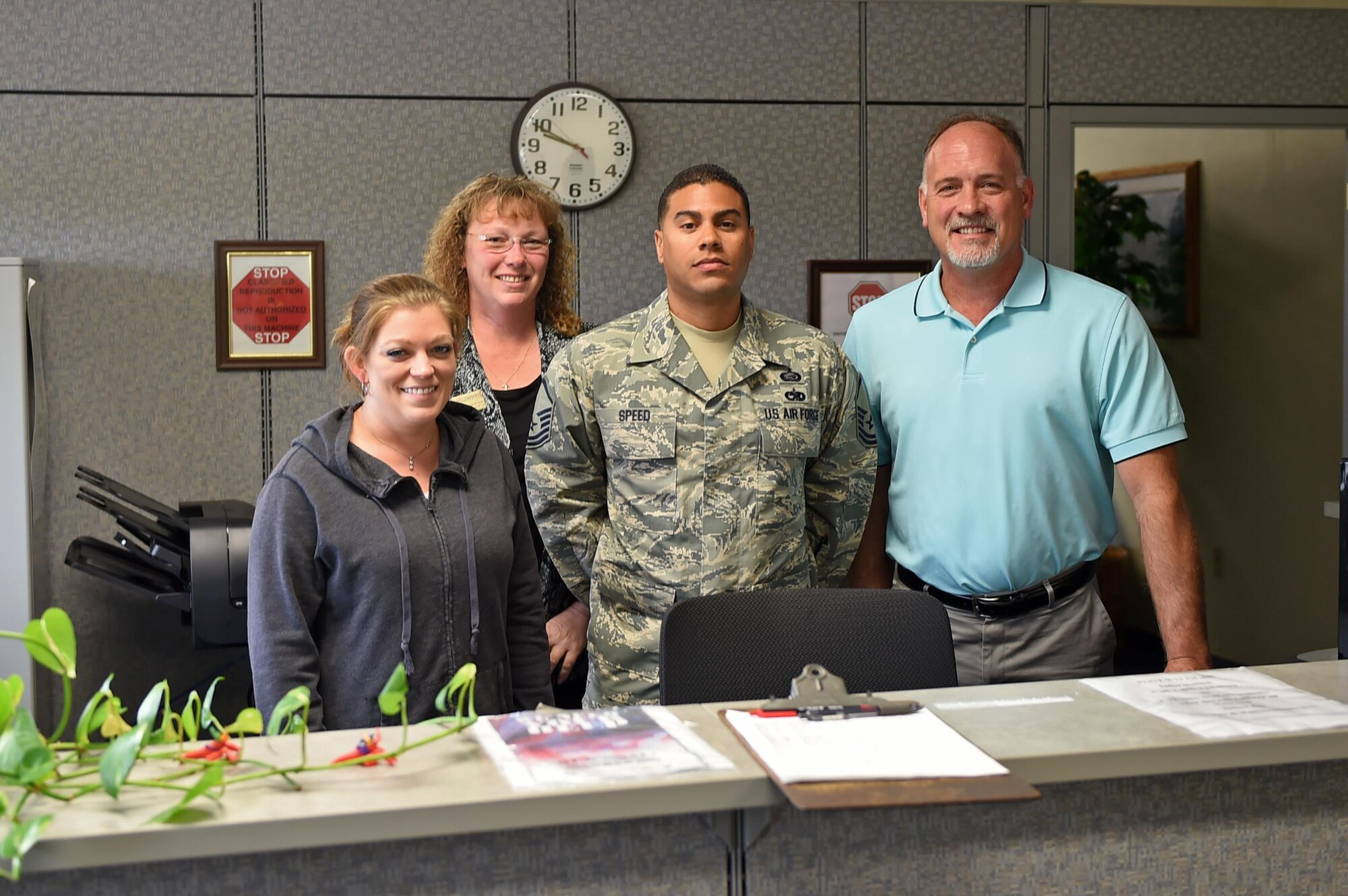 Members of the Altus Air Force Base Education Office stand behind the customer service counter of the education office Oct. 13, 2016 at Altus AFB, Okla. The education office provides a variety of services to enlisted and commissioned military members as well as civilian employees here at Altus AFB. For additional information, contact the education office at 580-481-6619. (U.S. Air Force photo by Staff Sgt. Dillon Davis)