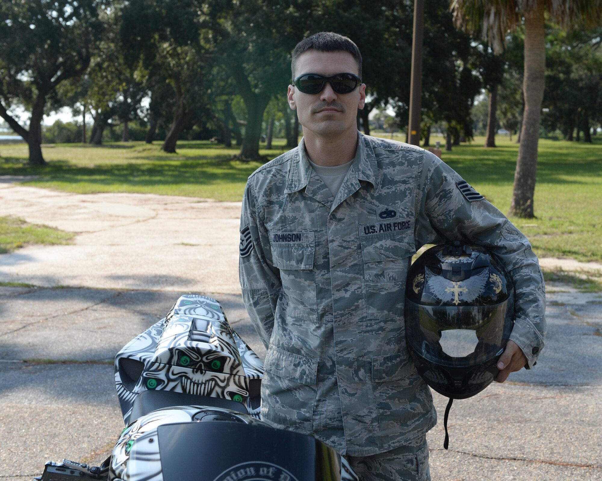 U.S. Air Force Tech. Sgt. Steven Johnson, 44th Fighter Group aircraft armaments systems technician, stands next to his motorcycle at Tyndall Air Force Base, Fla., Sept. 28, 2016. Johnson was active duty for over 11 years before transitioning to the Air Force Reserve to continue to serve his country. (U.S. Air Force photo by Airman 1st Class Cody R. Miller/Released)