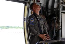 Philippine Air Force Tech. Sgt. Randy Avenico, C-130 flight engineer, observes preparatory operations for a low-cost, low-altitude airdrop during the current iteration of a rotational Air Contingent at Brigadier General Benito N Ebuen Air Base, Lapu-Lapu City, Philippines, Oct. 5, 2016. For the exchange, U.S. Air Force C-130 Hercules aircraft from Yokota Air Base's 374th Airlift Wing flew with members of the Philippine Air Force's 220th Airlift Wing, from Brig. Gen. Benito N. Ebuen Air Base, Lapu-Lapu City, Philippines, and discussed the intricacies of LCLA bundle drops. Two Yokota-based C-130s and crews, members of the 36th Contingency Response Group, Andersen Air Force Base, Guam, and other units from across U.S. Pacific Command conducted bilateral training missions and subject matter expert exchanges alongside their Philippine Air Force counterparts. The Air Contingent is helping build the capacity of the Philippine Air Force and increases joint training, promotes interoperability and provides greater and more transparent air and maritime situational awareness to ensure safety for military and civilian activities in international waters and airspace. Its missions include air and maritime domain awareness, personnel recovery, combating piracy, and assuring access to the air and maritime domains in accordance with international law. (U.S. Air Force photo by Capt. Mark Lazane)