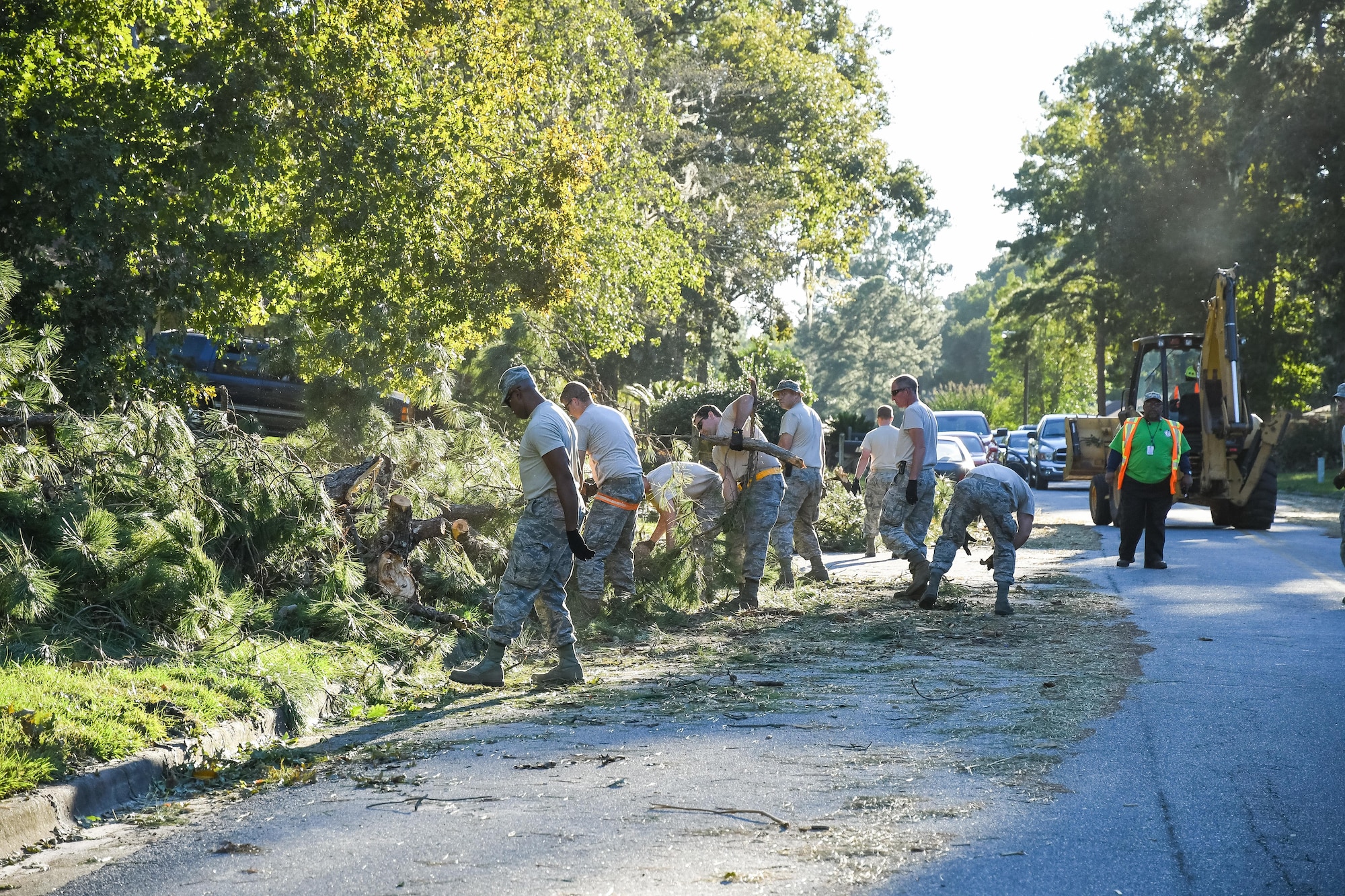 Citizen Airmen from 116th Air Control Wing (ACW), Georgia Air National Guard, along with workers from Chatham County Public Works, clear fallen trees from roadways in the aftermath of Hurricane Matthew, Savannah, Ga., Oct. 9, 2016. The Airmen from the 116th ACW deployed to Savannah to support civil authorities, are working along side the Chatham County Public Works department to assist in road clearing and debris cleanup operations. (U.S. Air National Guard photo by Senior Master Sgt. Roger Parsons)