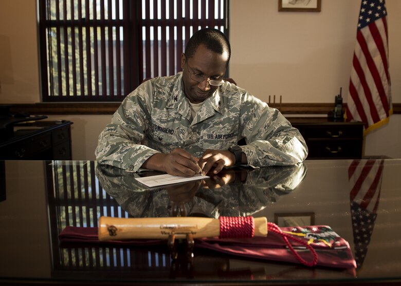 Col. Kelvin Townsend, 91st Missile Wing vice commander, donates to the Combined Federal Campaign at Minot Air Force Base, N.D., Oct. 7, 2016. In 2015, the total amount contributed by both military and civilian donors in Minot AFB was $110,000. This year, Team Minot's campaign runs until Oct. 22, 2016, with a goal of $125,000. (U.S. Air Force photo/Airman 1st Class J.T. Armstrong)