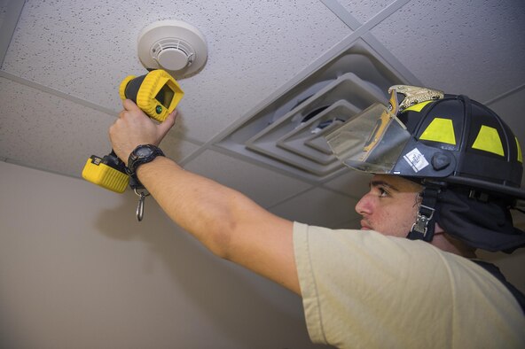 Airman 1st Class Jacob Black, 23d Civil Engineer Squadron firefighter, checks a smoke alarm with a thermal engine camera during Fire Prevention Week, Oct. 13, 2016, at Moody Air Force Base, Ga. This year’s FPW theme is “Don’t wait, check the date,” which raises awareness of the importance of smoke alarms and encourages people to change their alarms at least once every 10 years. (Photo by Airman 1st Class Greg Nash)