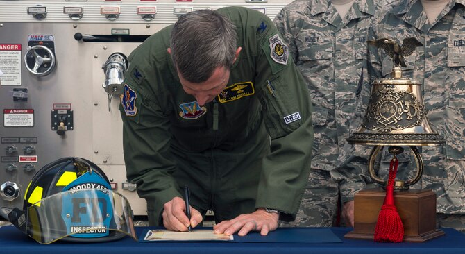 Col. Thomas Kunkel, 23d Wing commander, signs a proclamation designating the second week of October as Fire Prevention Week, Sept. 26, 2016, at Moody Air Force Base, Ga. The week, celebrated annually, commemorates the Great Chicago Fire of 1871 that took the lives of over 250 people, left a 100,000 homeless and destroyed more than 17,400 buildings. (U.S. Air Force Photo by Airman 1st Class Greg Nash)