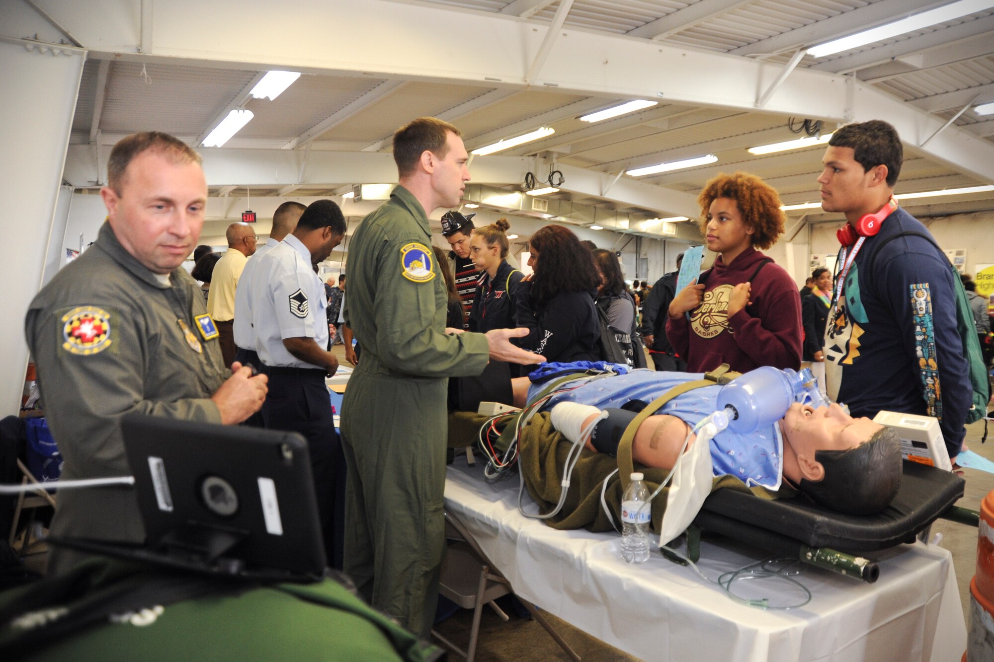 Members of the 459th Air Refueling Wing showcase their missions to a group of high school students at the Virginia Department of Transportation Career Fair in Manassas, Virginia, Thursday, Oct. 7, 2016. More than 1,400 students came out to talk with recruiters, a boom operator, aeromedical evacuation technician, and aeromedical staging squadron first sergeant about transportation-related careers in the Air Force Reserve and 459th ARW. (U.S.Air Force photo/Staff Sgt. Kat Justen)