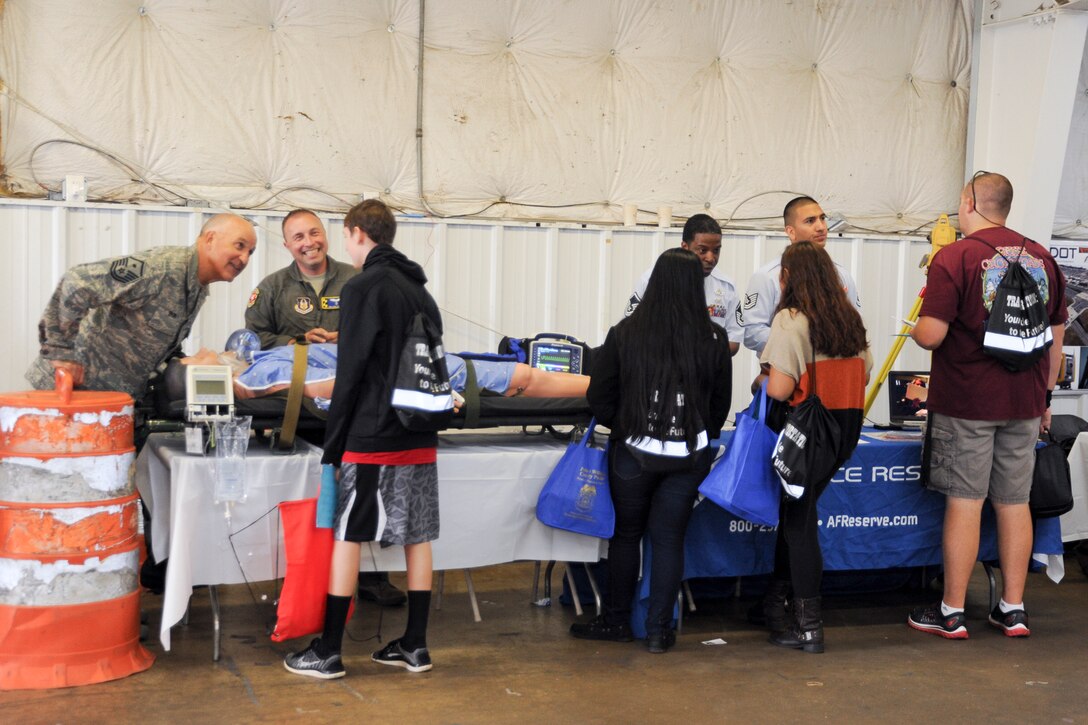 Members of the 459th Air Refueling Wing showcase their missions to a group of high school students at the Virginia Department of Transportation Career Fair in Manassas, Virginia, Thursday, Oct. 7, 2016. More than 1,400 students came out to talk with recruiters, a boom operator, aeromedical evacuation technician, and aeromedical staging squadron first sergeant about transportation-related careers in the Air Force Reserve and 459th ARW. (U.S.Air Force photo/Staff Sgt. Kat Justen)