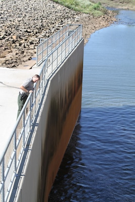 Derek Dorsey, Smithville Lake park manager, inspects the dam and spillway for any signs of distress following seismic activity 3 Sept. 