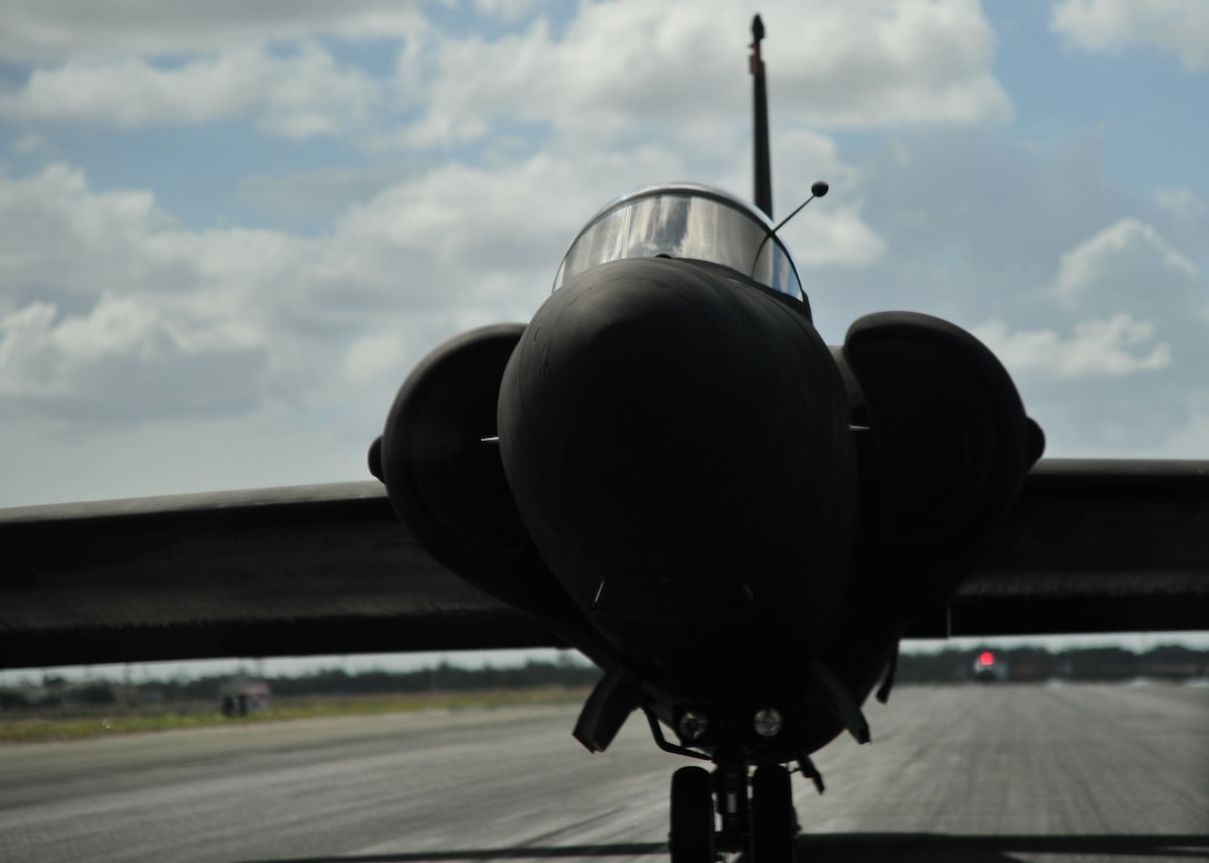 A U-2 Dragon Lady stops on the runway at Joint Base Pearl Harbor-Hickam (JBPHH), Hawaii, Oct. 3, 2016. The jet was met by an en route recovery team (ERT) from the 9th Aircraft Maintenance Squadron. Due to the bicycle-style landing gear, the U-2 tips to one side when it comes to a complete stop. Temporary-supporting wheels are placed under the wings by the ERT, allowing it to taxi. The U-2 is transitioning through JBPHH for the first time in over two years as it moves to and from Beale Air Force Base, California. This type of movement enables warfighters to provide vital intelligence to senior Air Force and civilian leaders. (U.S. Air Force photo by Tech. Sgt Aaron Oelrich/Released)