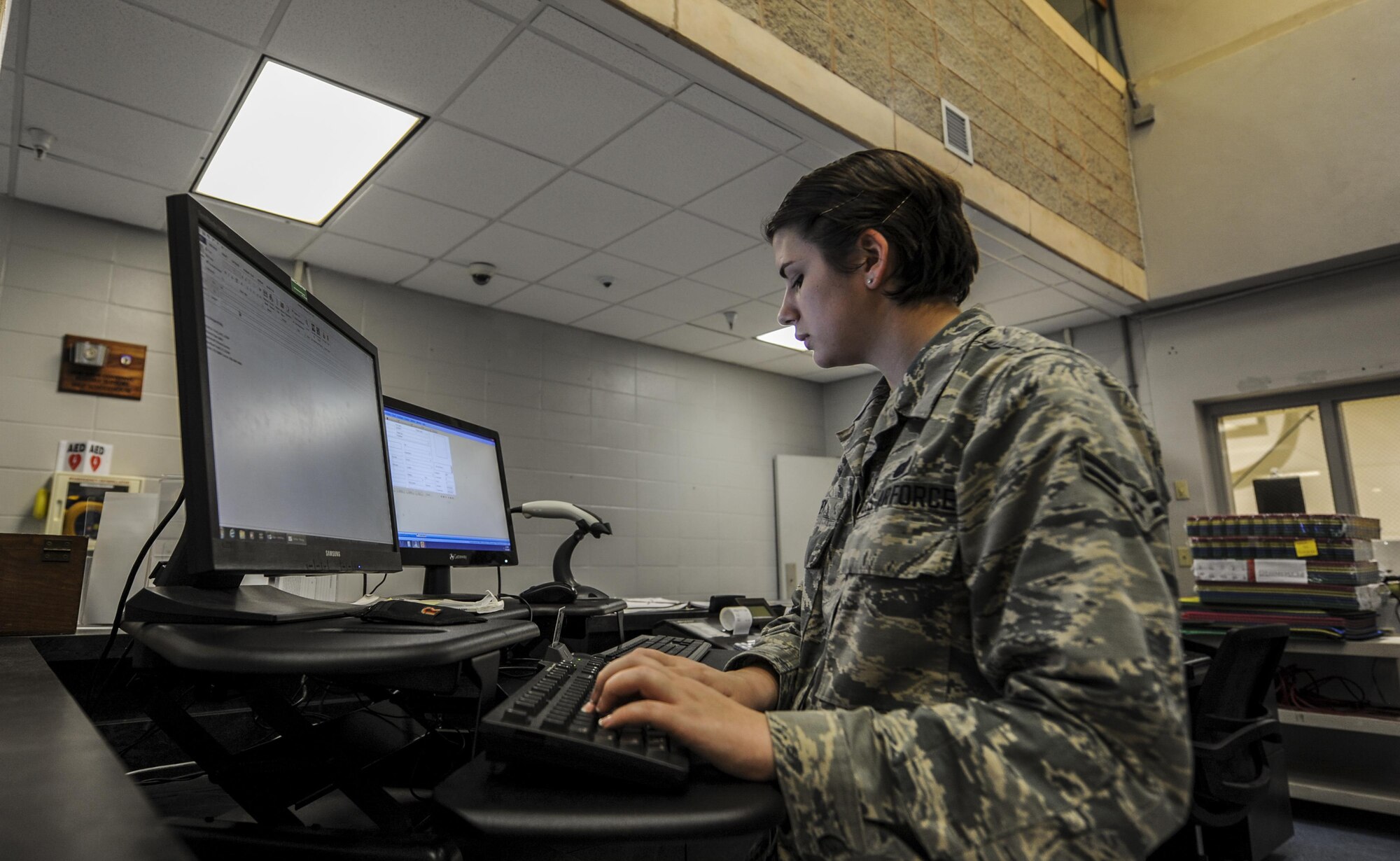Airman 1st Class Kristi Frey, a fitness specialist with the 1st Special Operations Force Support Squadron, reserves the football field for squadrons at Hurlburt Field, Fla., Oct. 12, 2016. Daily tasks for fitness specialists vary from cleaning, organizing and issuing equipment, to teaching classes, maintaining the facility and assisting customers. (U.S. Air Force photo by Airman 1st Class Isaac O. Guest IV)