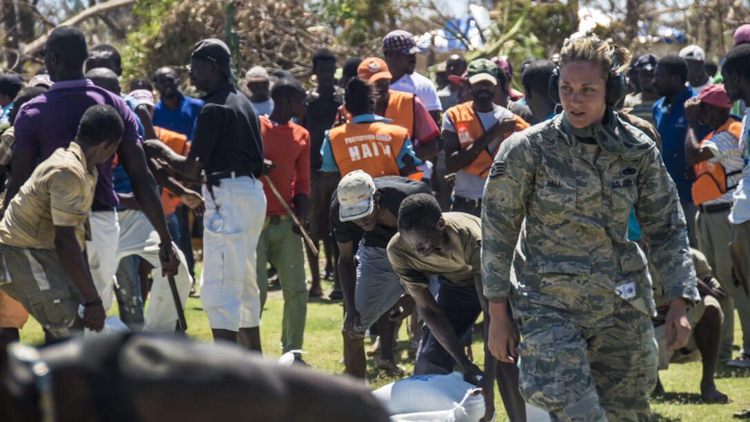 <strong>Photo of the Day: Oct. 14, 2016</strong><br/><br />Air Force Staff Sgt. Jessie Hall offloads food to the survivors of Hurricane Matthew in Dame Marie, Haiti, Oct. 12th, 2016. Hall is assigned to the 621st Contingency Response Wing, which is helping Joint Task Force Matthew support Haiti's request for humanitarian assistance. Air Force photo by Staff Sgt. Robert Waggoner<br/><br /><a href="http://www.defense.gov/Media/Photo-Gallery?igcategory=Photo%20of%20the%20Day"> Click here to see more Photos of the Day. </a>