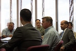 Col. Craig Johnson, base civil engineer at Eglin Air Force Base, Florida, addresses Air Force and commercial personnel involved with the recent utilities privatization, UP, award at Eglin AFB during a contract award meeting Oct. 4. Choctawhatchee Electrical Cooperative was awarded the UP contract to privatize Eglin’s electric utility system, making Eglin the second Air Force installation to privatize all four utility systems. (U.S. Air Force Photo/Jessica Dupree/Released 