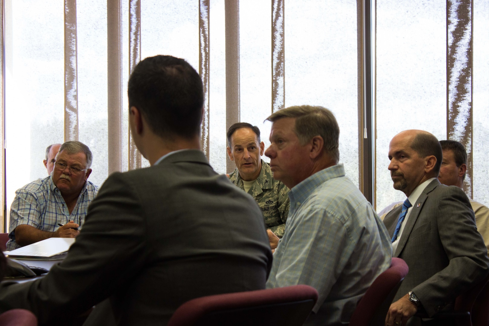 Col. Craig Johnson, base civil engineer at Eglin Air Force Base, Florida, addresses Air Force and commercial personnel involved with the recent utilities privatization, UP, award at Eglin AFB during a contract award meeting Oct. 4. Choctawhatchee Electrical Cooperative was awarded the UP contract to privatize Eglin’s electric utility system, making Eglin the second Air Force installation to privatize all four utility systems. (U.S. Air Force Photo/Jessica Dupree/Released 