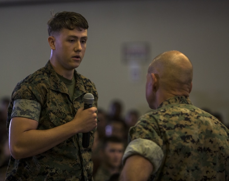 Pfc. Lucas Smith asks Gen. Robert B. Neller a question during his visit to Camp Kinser, Okinawa, Japan, October 13, 2016. Neller is visiting III Marine Expeditionary Force to reinforce the importance of every Marine and Sailor and their role in continuing the mission of the ‘Fight Tonight’ MEF. Whether responding to a crisis or natural disaster, III MEF continues to train to ensure its capabilities in keeping peace and security throughout the region. “I’m not looking to pick a fight with anybody, but you need to be ready to go,” said Neller. Neller, from East Lansing, Michigan, is the commandant of Marine Corps. Smith, from Cleveland, Ohio is a warehouse clerk at 3rd Supply Battalion, 3rd Supply Company, III Marine Logistics Group, III MEF. (U.S. Marine Corps photo by Cpl. Jessica Etheridge / Released) 