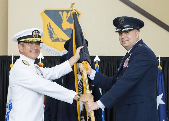 U.S. Air Force Lt. Gen. Jerry P. Martinez, incoming United States Forces, Japan and 5th Air Force commander, accepts the guidon from Adm. Harry B. Harris Jr., U.S. Pacific Command commander, during the Assumption of Command ceremony October 6, 2016, at Yokota Air Base, Japan. Harris and Gen. Terrence J. O’Shaughnessy, Pacific Air Forces commander, presided over the ceremony. (U.S. Air Force photo by Airman 1st Class Donald Hudson/Released.) 
