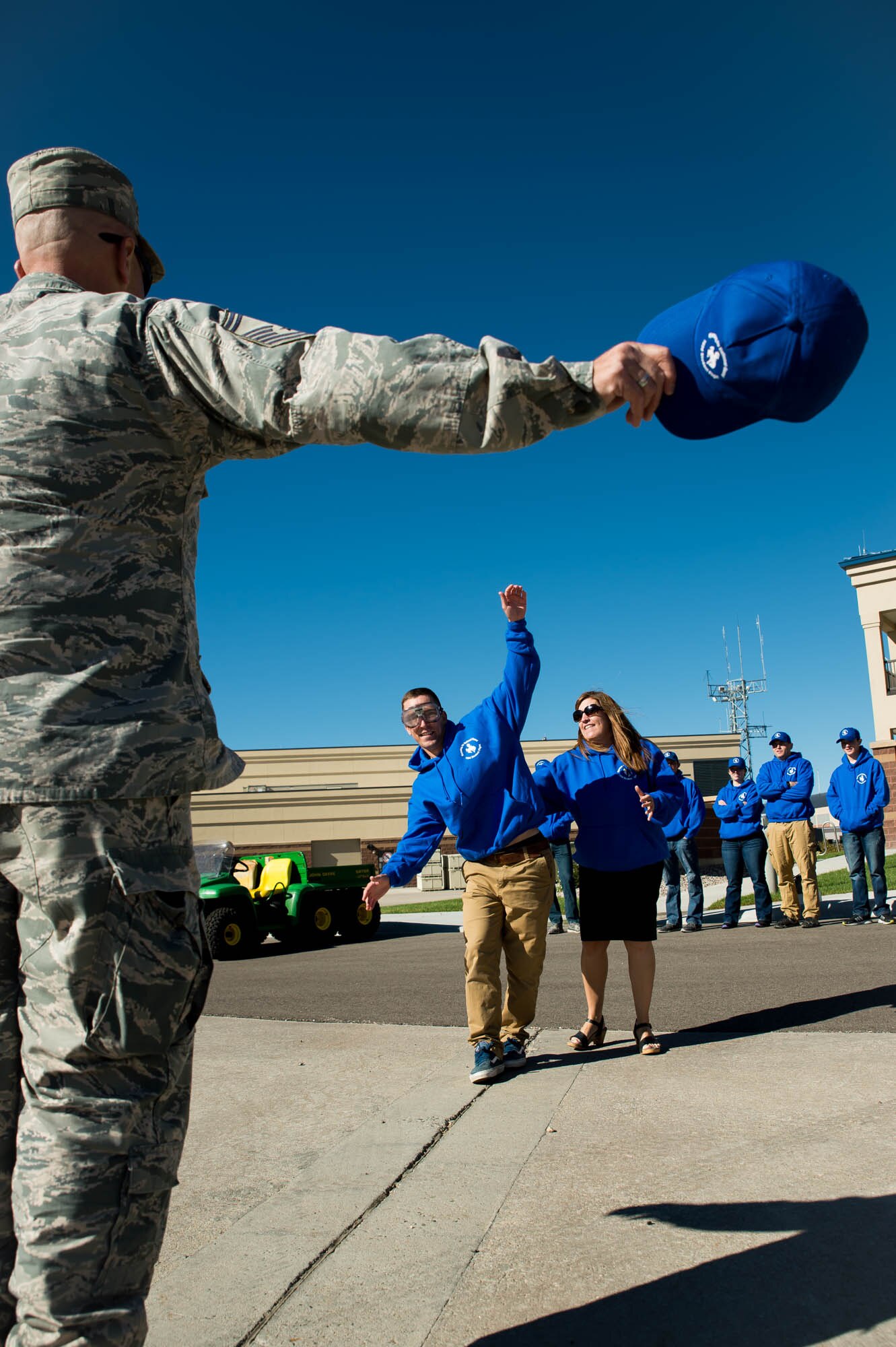 David Dunn (center), a 153rd Airlift Wing Student Flight trainee and future 
fire protection specialist, attempts to walk in a straight line during a mock 
sobriety test Sept. 10, 2016, at the Wyoming Air National Guard Base in 
Cheyenne, Wyo. Senior Master Sgt. James Lambert (foreground), student flight noncommissioned officer in charge, stands as a vocal guide during the test while Jenny Rigg, director of psychological health, walks along side students for to ensure they do not fall over. The training was intended for student flight trainees to learn about and experience the effects of alcohol-impaired driving in a fun, safe and effective way. (U.S. Air National Guard photo by Master Sgt. Leisa Grant / Released)