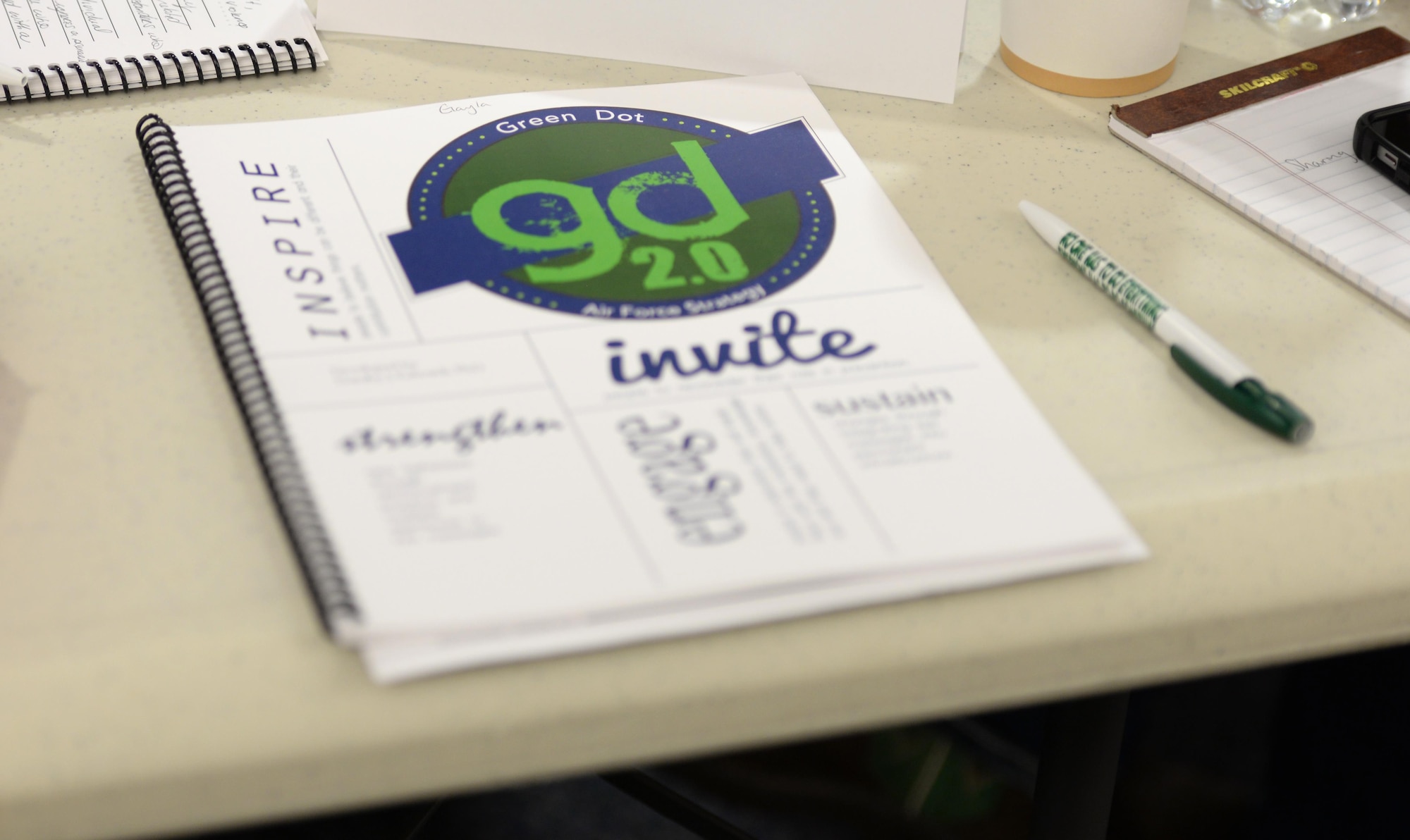 A manual rests on a desk during Green Dot training Oct. 11, 2016, on RAF Mildenhall, England. During the training, the group used manuals to take notes, allowing them to bring the training back to their units. (U.S. Air Force photo by Gina Randall)