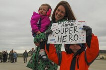 The wife and children of a pilot assigned to the 480th Expeditionary Fighter Squadron await to greet him during the squadron’s return to Spangdahlem Air Base, Germany, Oct. 6, 2016. Approximately 300 of the Airmen, who serve in flight, maintenance or support roles for the F-16 Fighting Falcon fighter aircraft, completed a six-month deployment to Southwest Asia by providing close air support and dynamic targeting operations as part of the squadron’s first deployment in support of Operation Inherent Resolve. Operation Inherent Resolve aims to eliminate the Da'esh terrorist group and the threat they pose to Iraq, Syria and the wider international community. (U.S. Air Force photo by Staff Sgt. Joe W. McFadden)