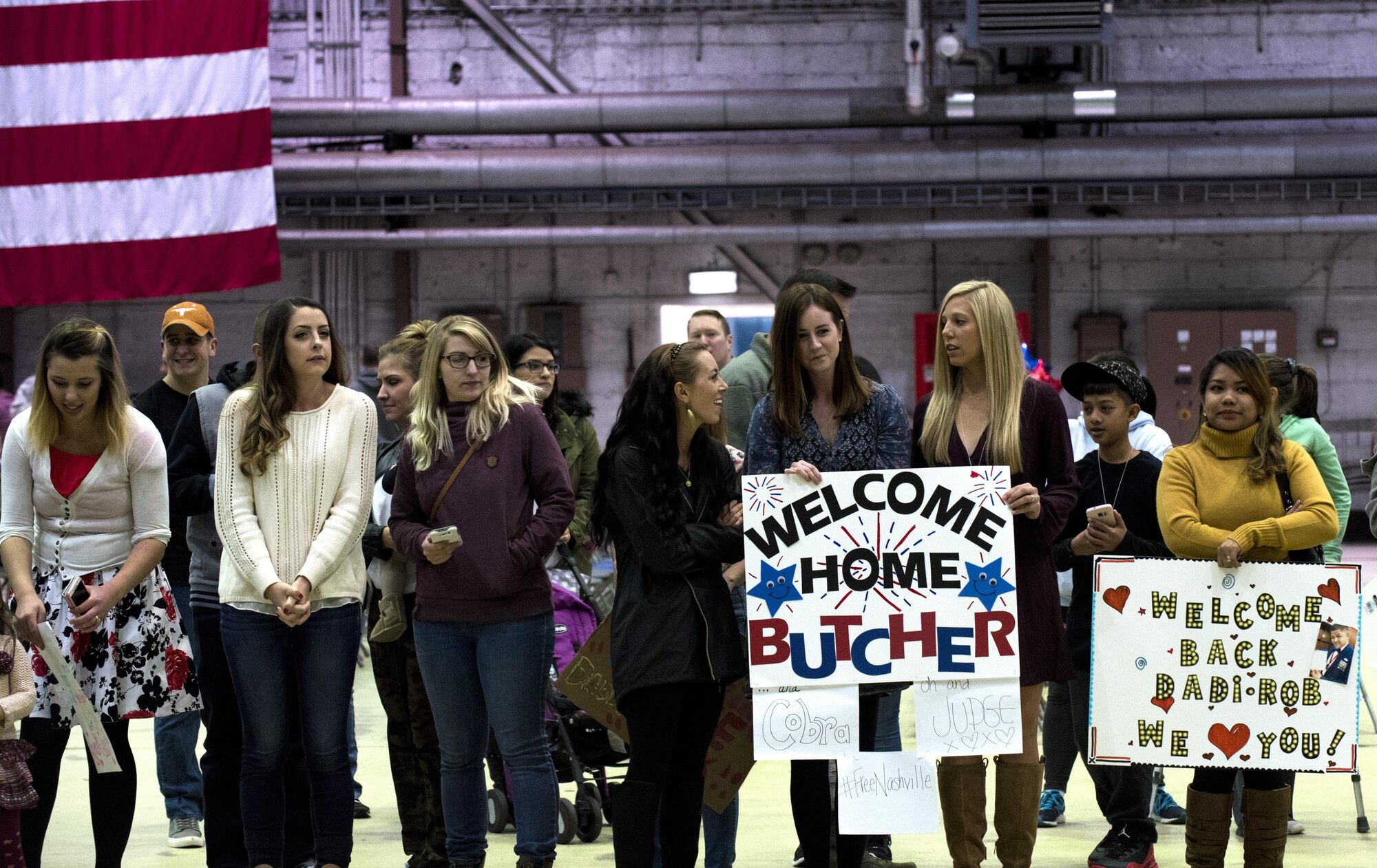 Friends and family members of Airmen assigned to the 480th Expeditionary Fighter Squadron await the squadron’s arrival back to Spangdahlem Air Base, Germany, Oct. 12, 2016. Approximately 300 squadron members arrived from a six-month deployment to Southwest Asia where they provided close air support and dynamic targeting operations in support of Operation Inherent Resolve. (U.S. Air Force photo/Airman 1st Class Preston Cherry)