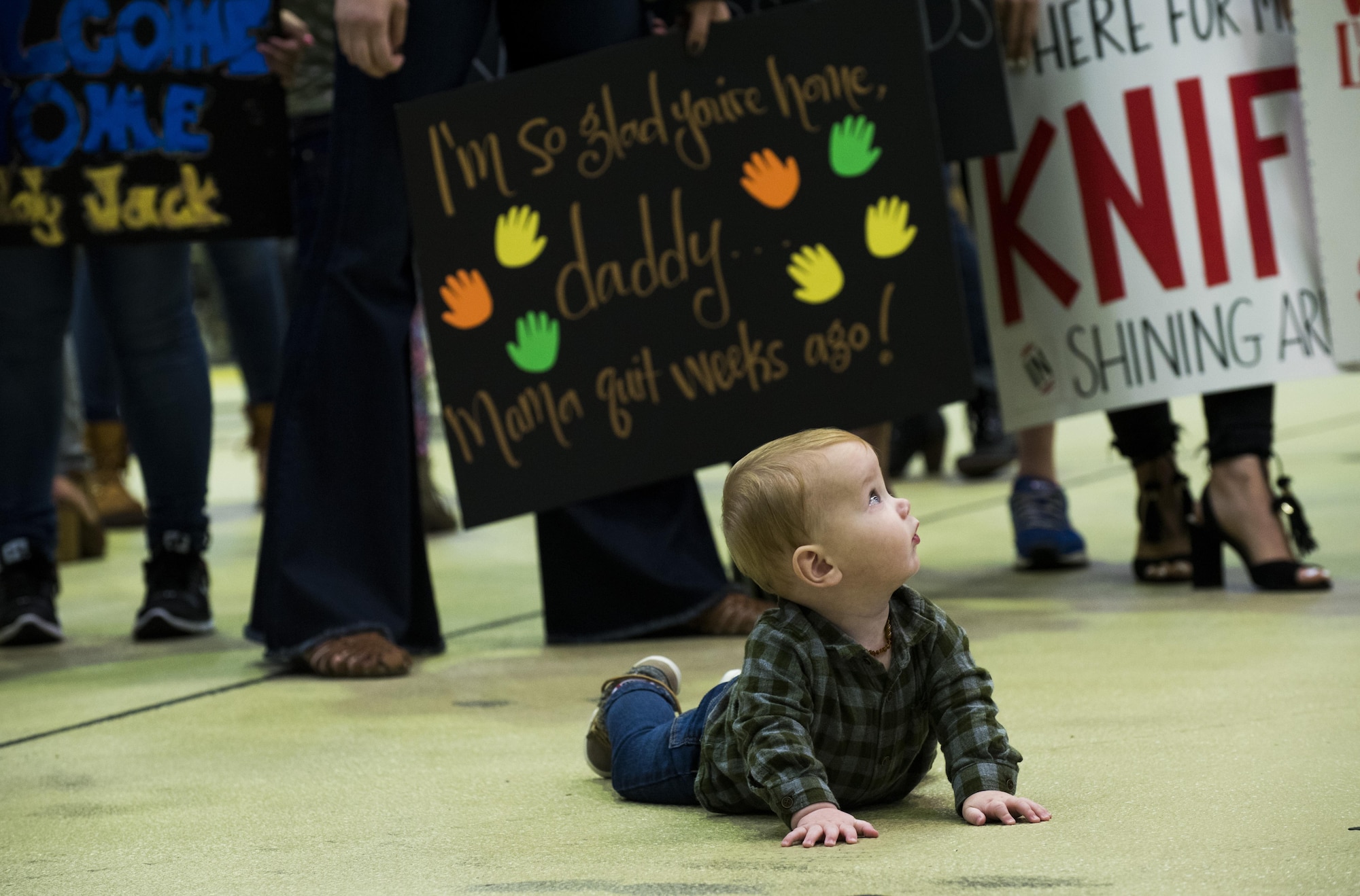 A child of a deployed Airman assigned to the 480th Expeditionary Fighter Squadron awaits the squadron’s return to Spangdahlem Air Base, Germany, Oct. 12, 2016. The 480th EFS served a six-month deployment in Southwest Asia in support of Operation Inherent Resolve, which aims to defeat enemy forces in the Combined Joint Force Area. (U.S. Air Force photo/Airman 1st Class Preston Cherry)